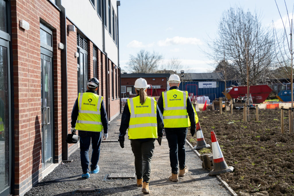 Three Dodd Group Employees walking together at work