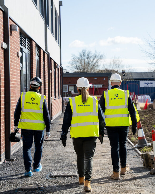 Three Dodd Group Employees walking together at work